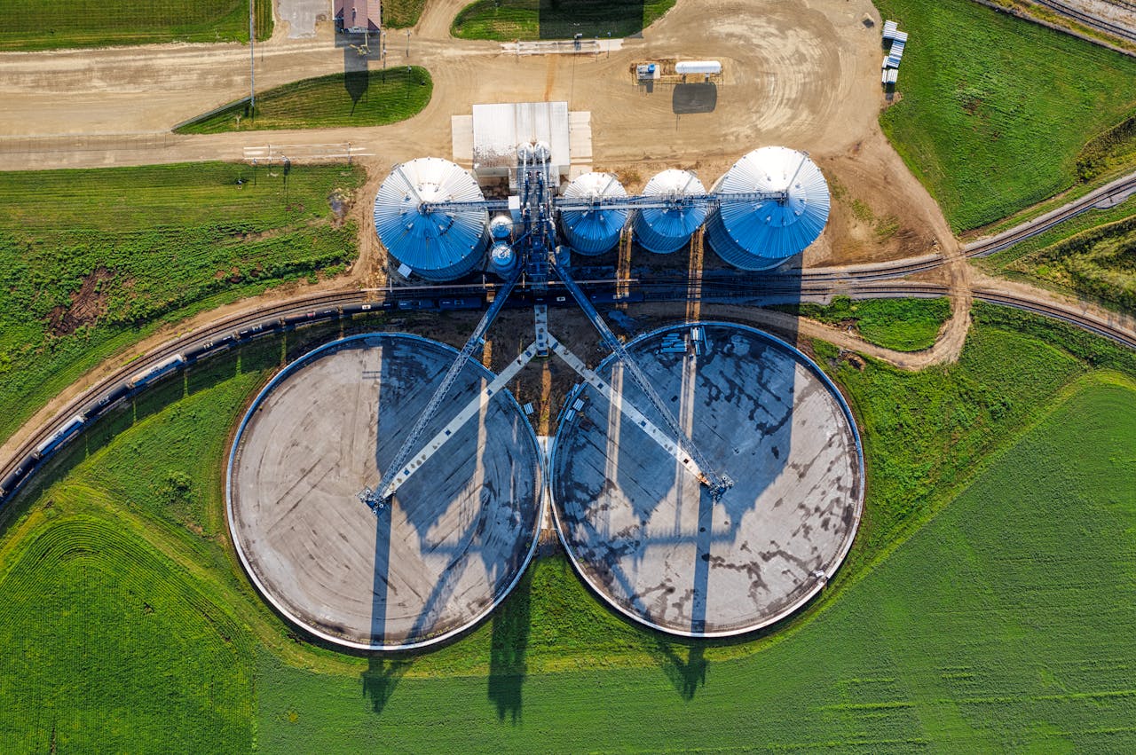 The Art of Drawing Readers In: Your attractive post title goes here Drone shot capturing modern silos in a vibrant green field in Randolph, MN.