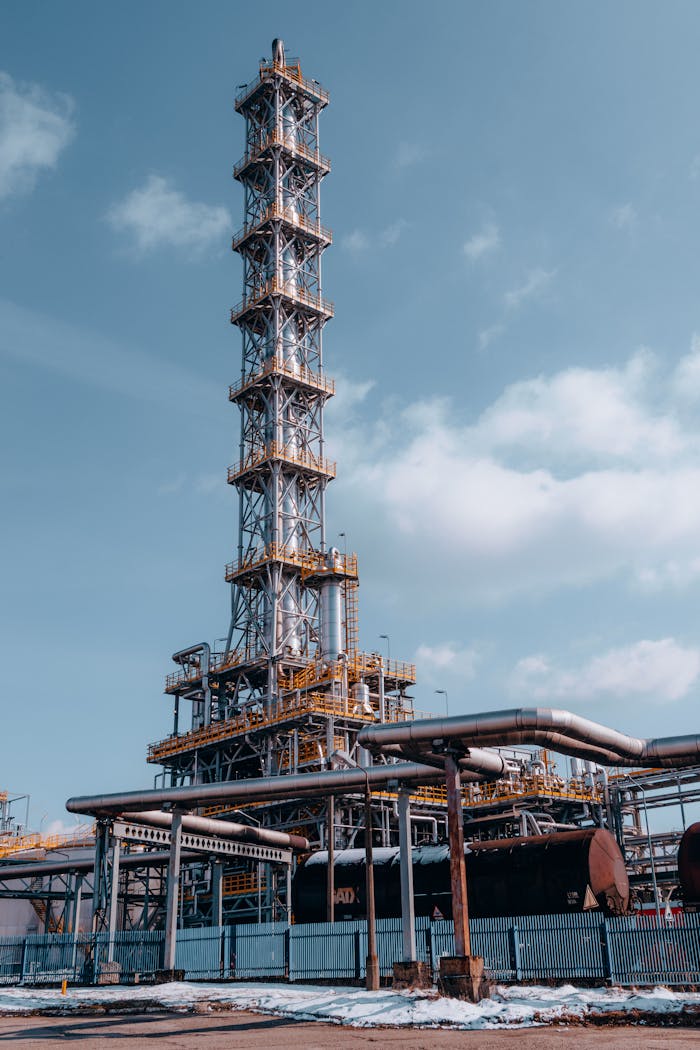 Mastering the First Impression: Your intriguing post title goes here Vertical shot of an oil refinery tower in Trzebinia, Poland against a clear sky.